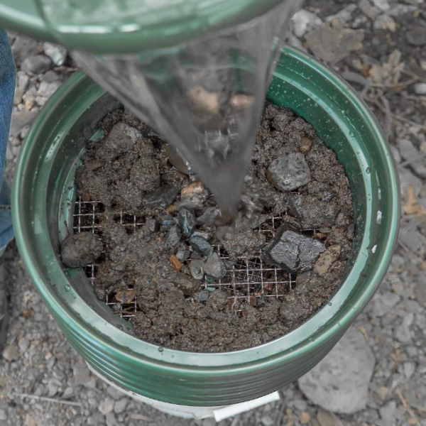 Green stainless steel mesh garden sieve, ideal for screening soil, gravel, and granular materials